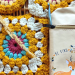 granny square in fall colors with crochet hook case with deer drawing and words "be kind."