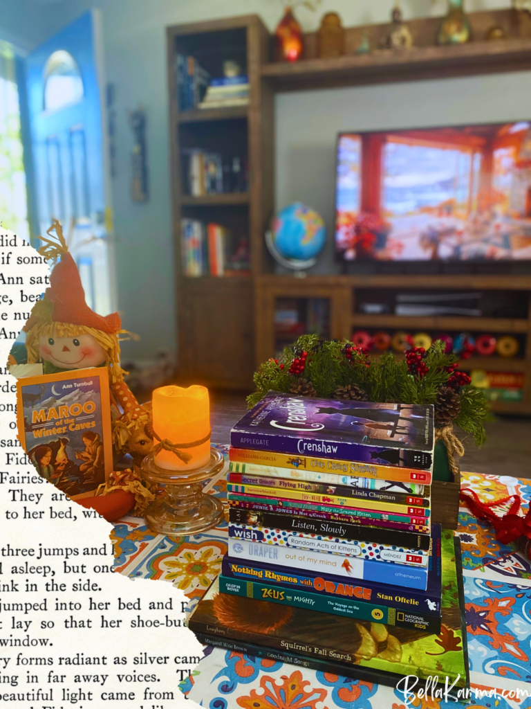 A stack of children's books sit on a fall-themed coffee table.